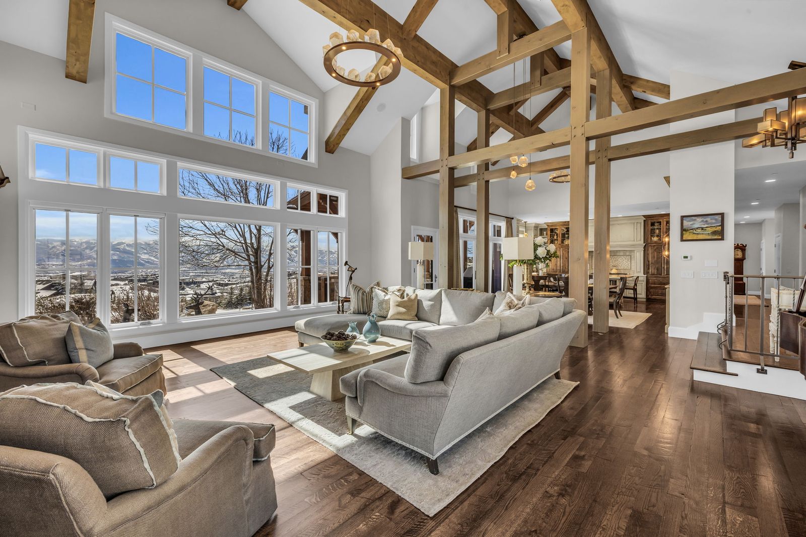 Great room with vaulted ceiling and wall of windows